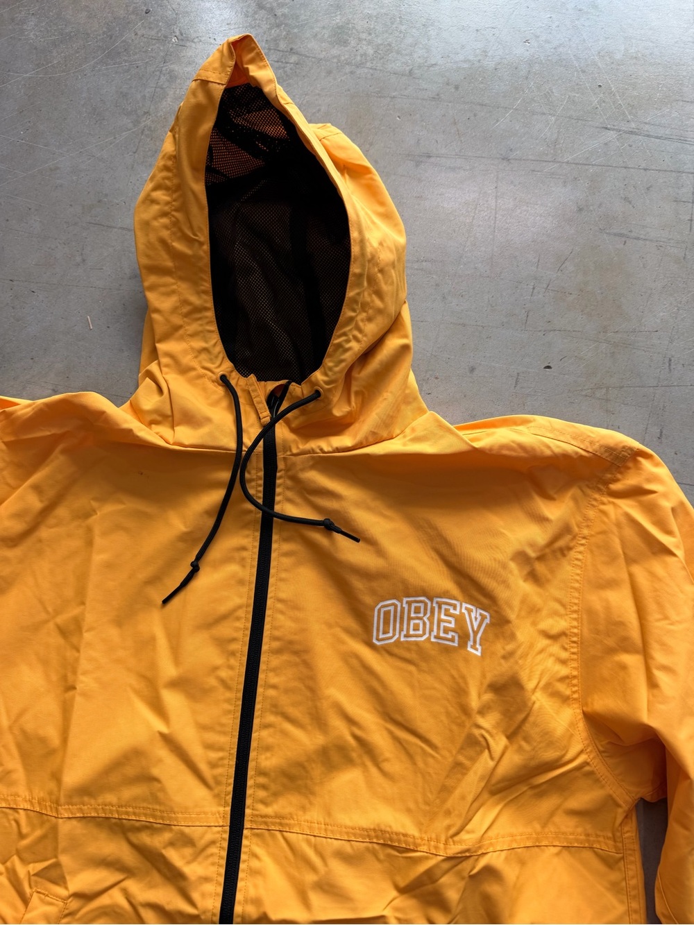 Obey Men’s Bright Yellow Hooded Windbreaker with Black Trim